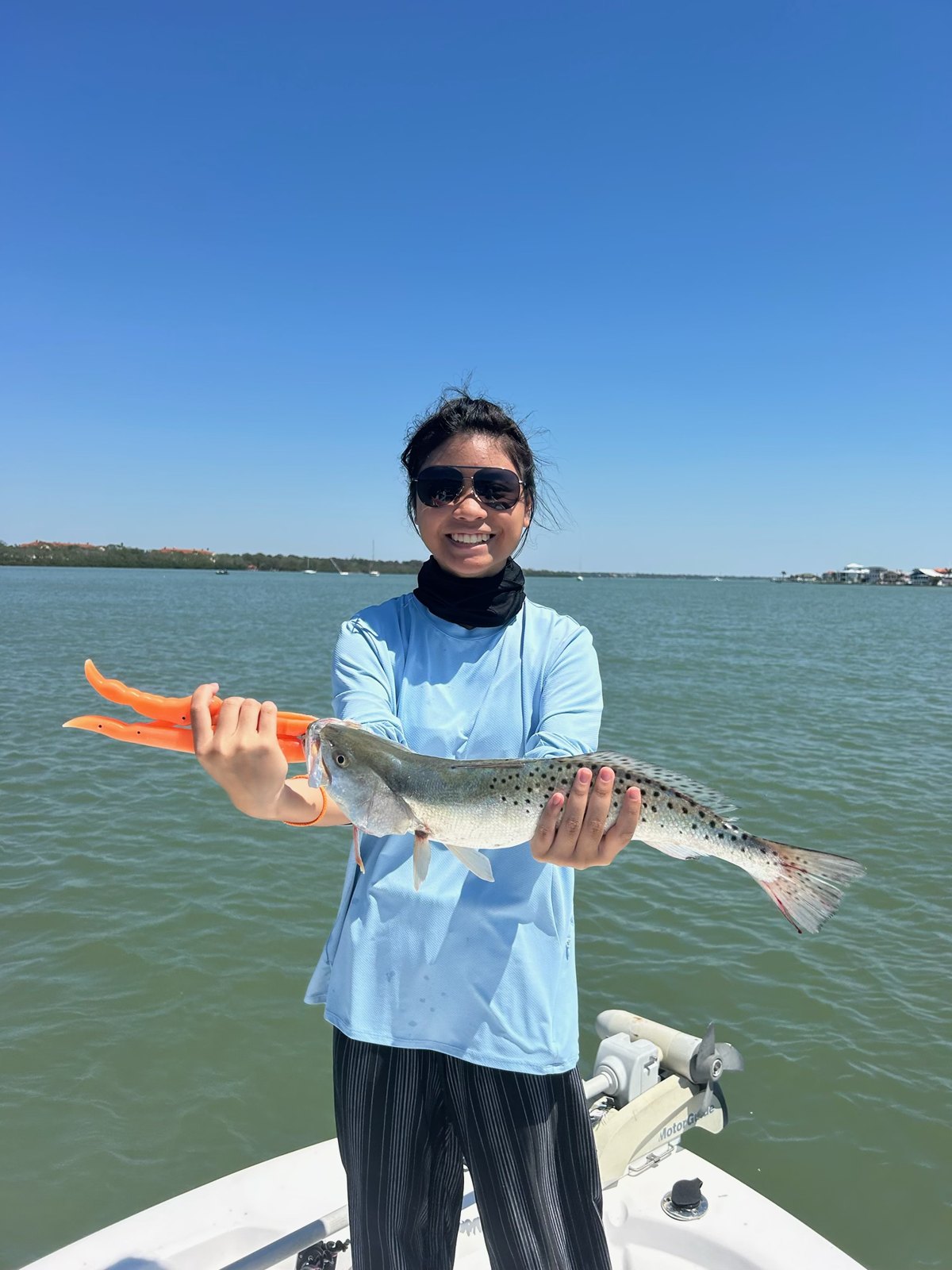 Speckled trout held up on the boat